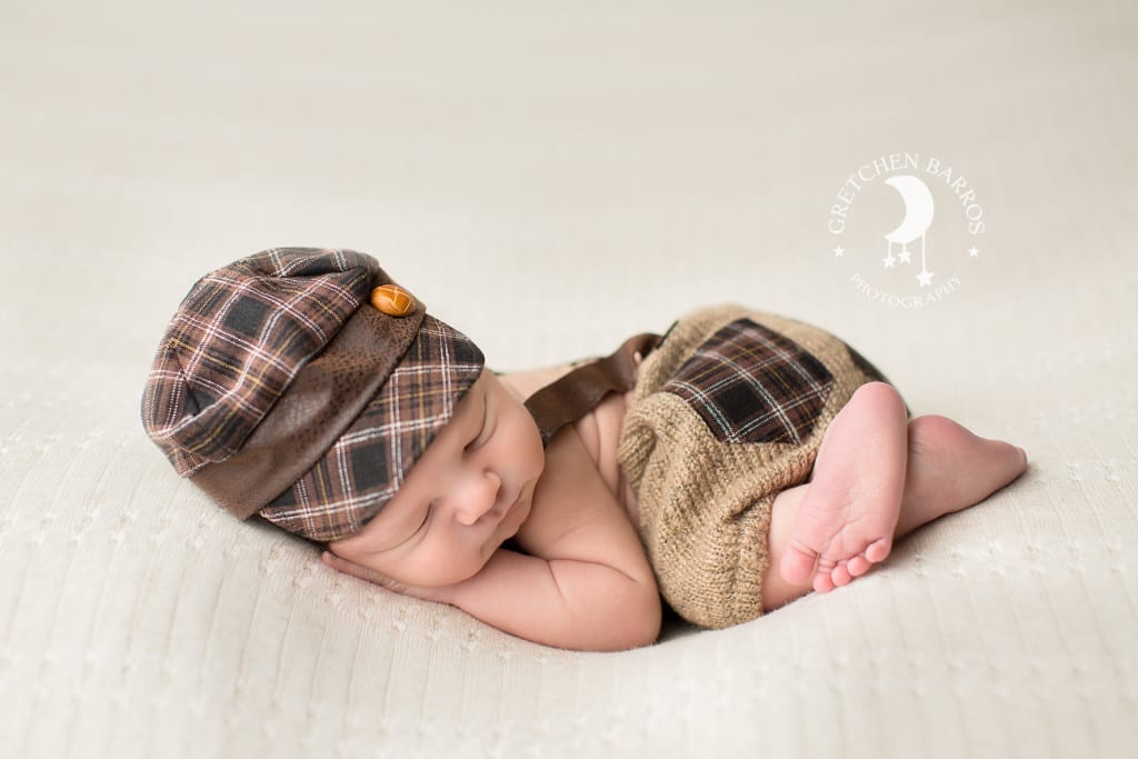 Newborn in hat and shorts