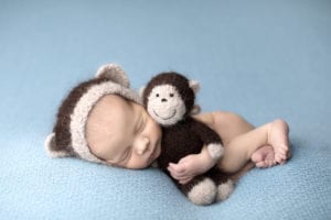 Vancouver_WA_Newborn_Photographer_Gretchen_Barros_Photography_Newborn_Boy_Holding_Monkey