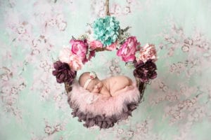 Temecula Newborn Photographer Baby in Floral swing
