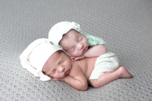 Portland Newborn Photographer twin sister sleeping on twin brother
