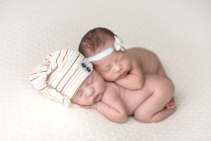 Portland Newborn Photographer twin newborns sleeping stacked on each other