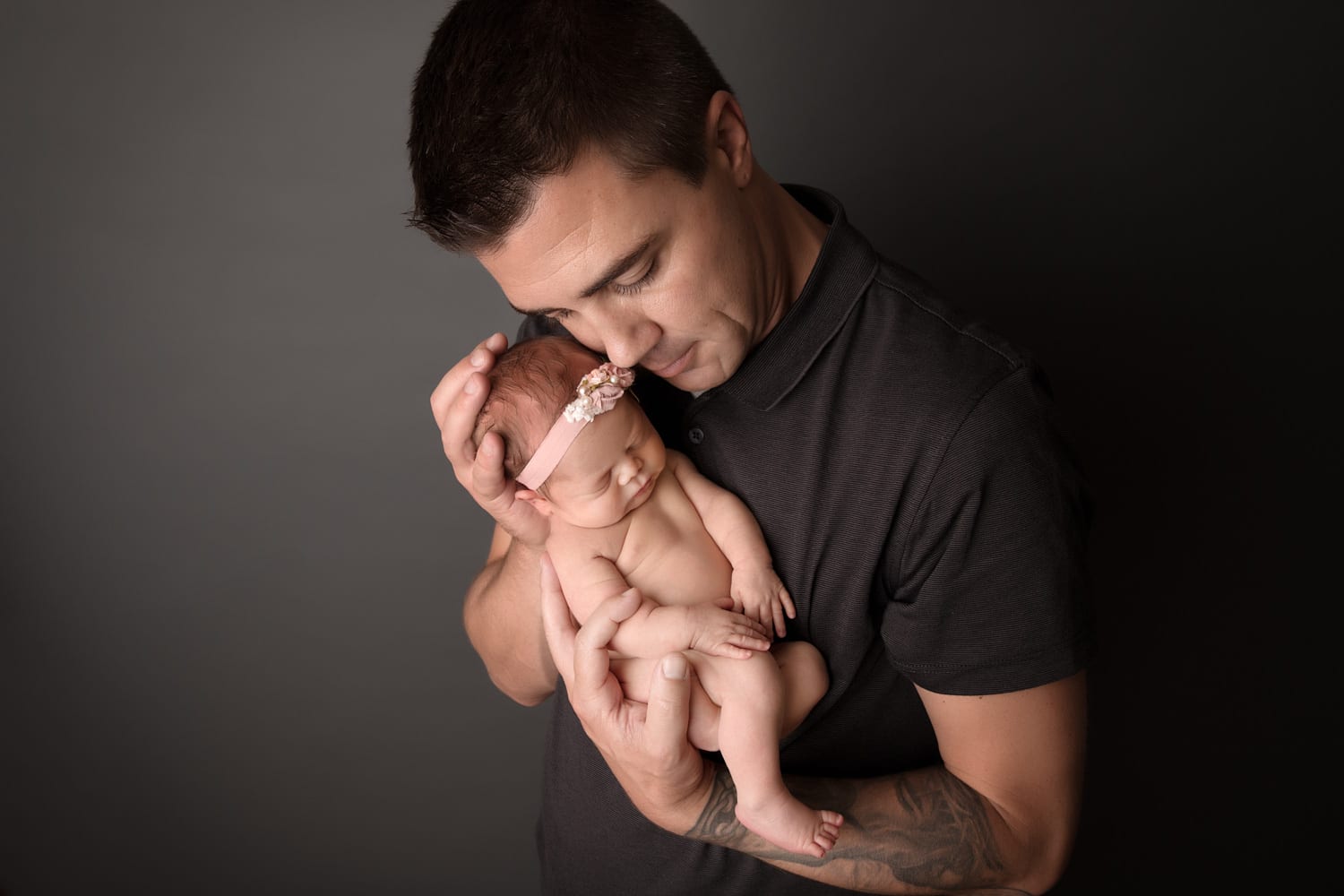Portland Newborn Photographer dad cuddling baby girl