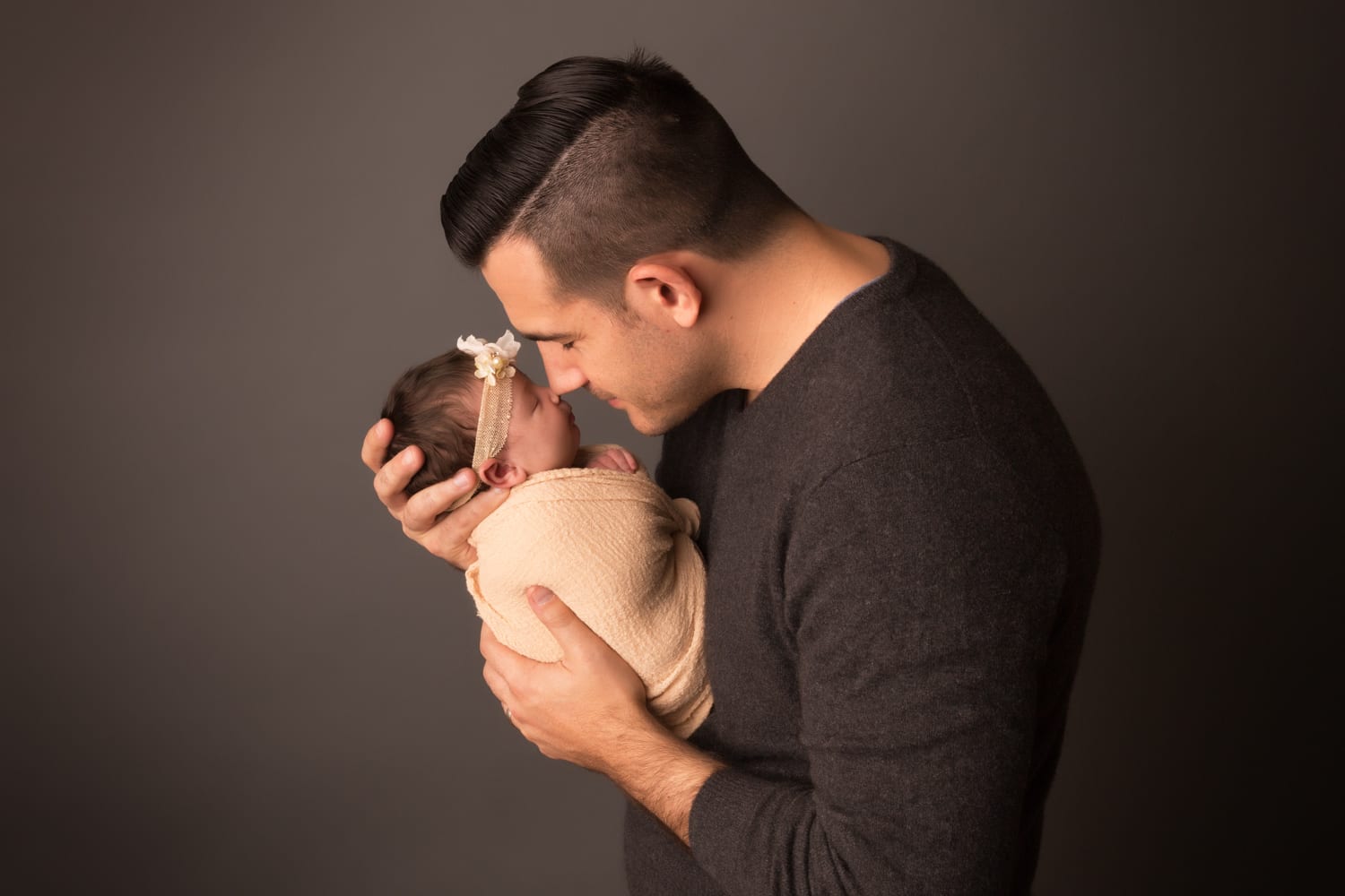 Portland Newborn Photographer dad touching noses with newborn baby girl