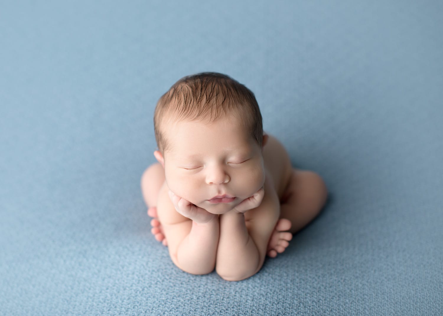 Portland Newborn Photographer baby boy froggy pose on light blue backdrop