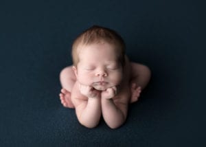 Portland Newborn Photographer baby boy froggy pose on navy