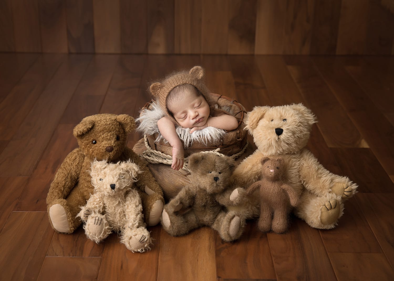 Portland Newborn Photographer baby boy in bear hat surrounded by teddy bears