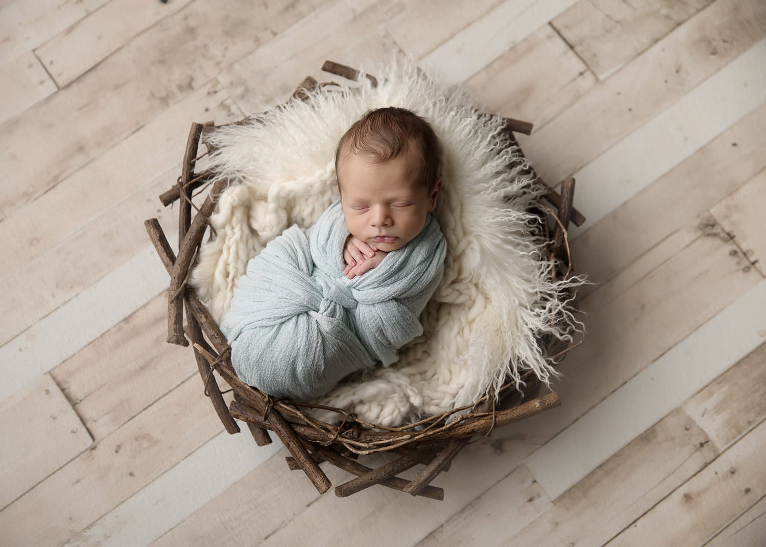 Portland Newborn Photographer baby boy in blue swaddle