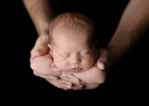 Portland Newborn Photographer boy in dad's hands