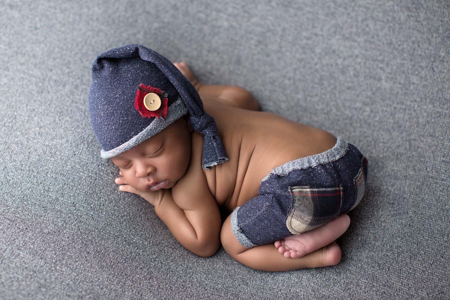 Portland Newborn Photographer Newborn in sleepy cap and shorts