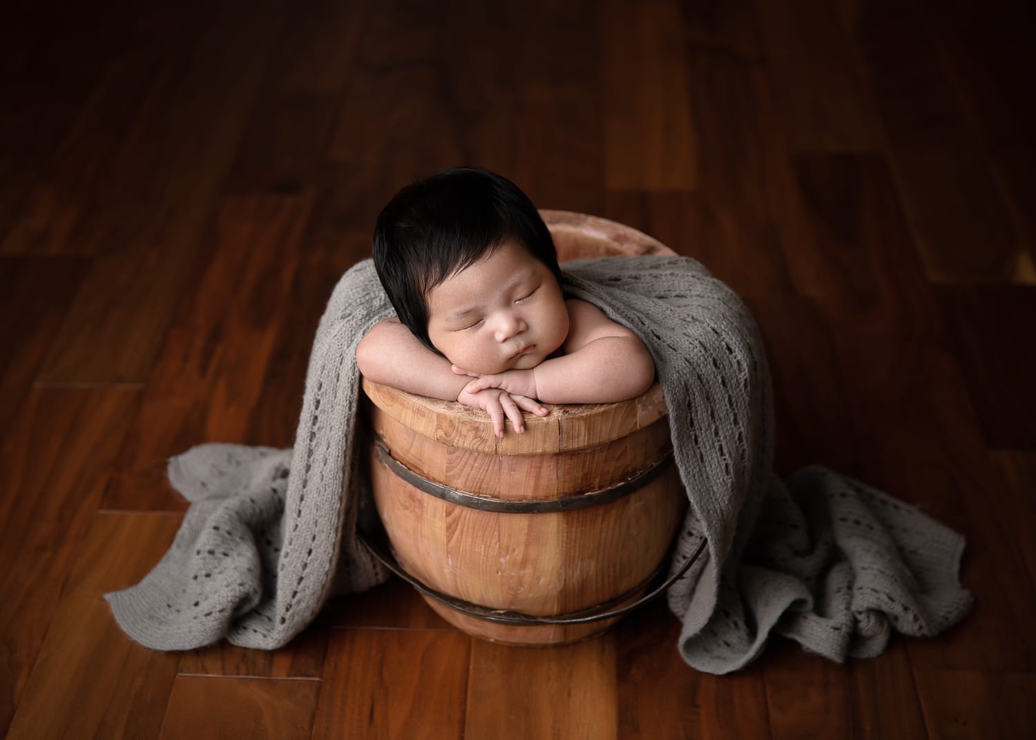 Portland Newborn Photographer baby boy in wood bucket