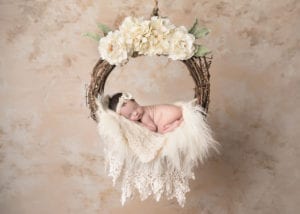 Portland Newborn Photographer baby in cream floral swing