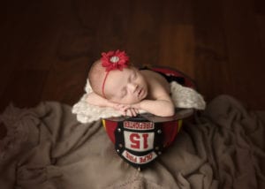 Portland Newborn Photographer baby in firefighter helmet