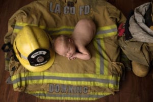 Portland Newborn Photographer Baby on Fireman Jacket