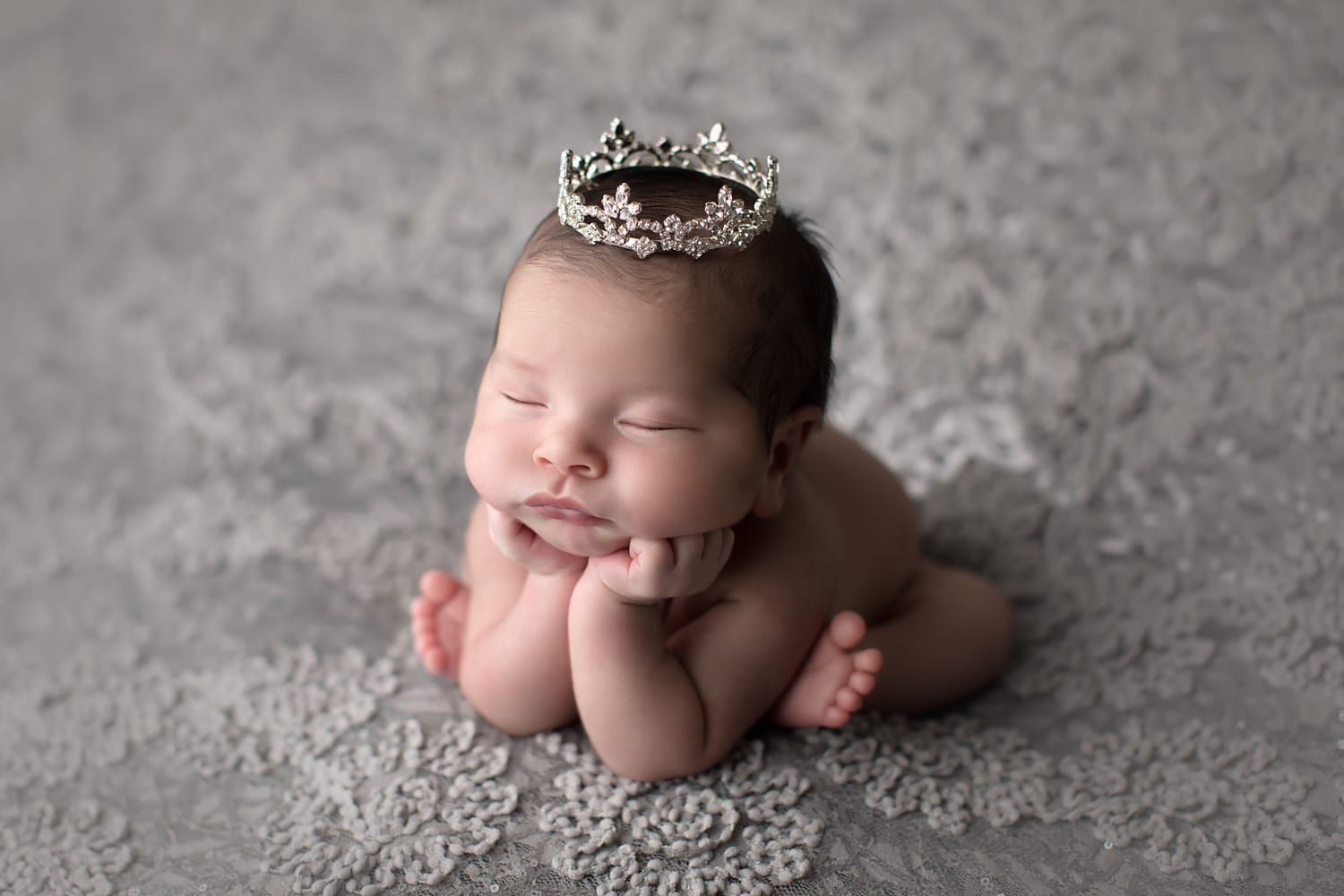 Portland Newborn Photographer Side angle froggy pose with tiara