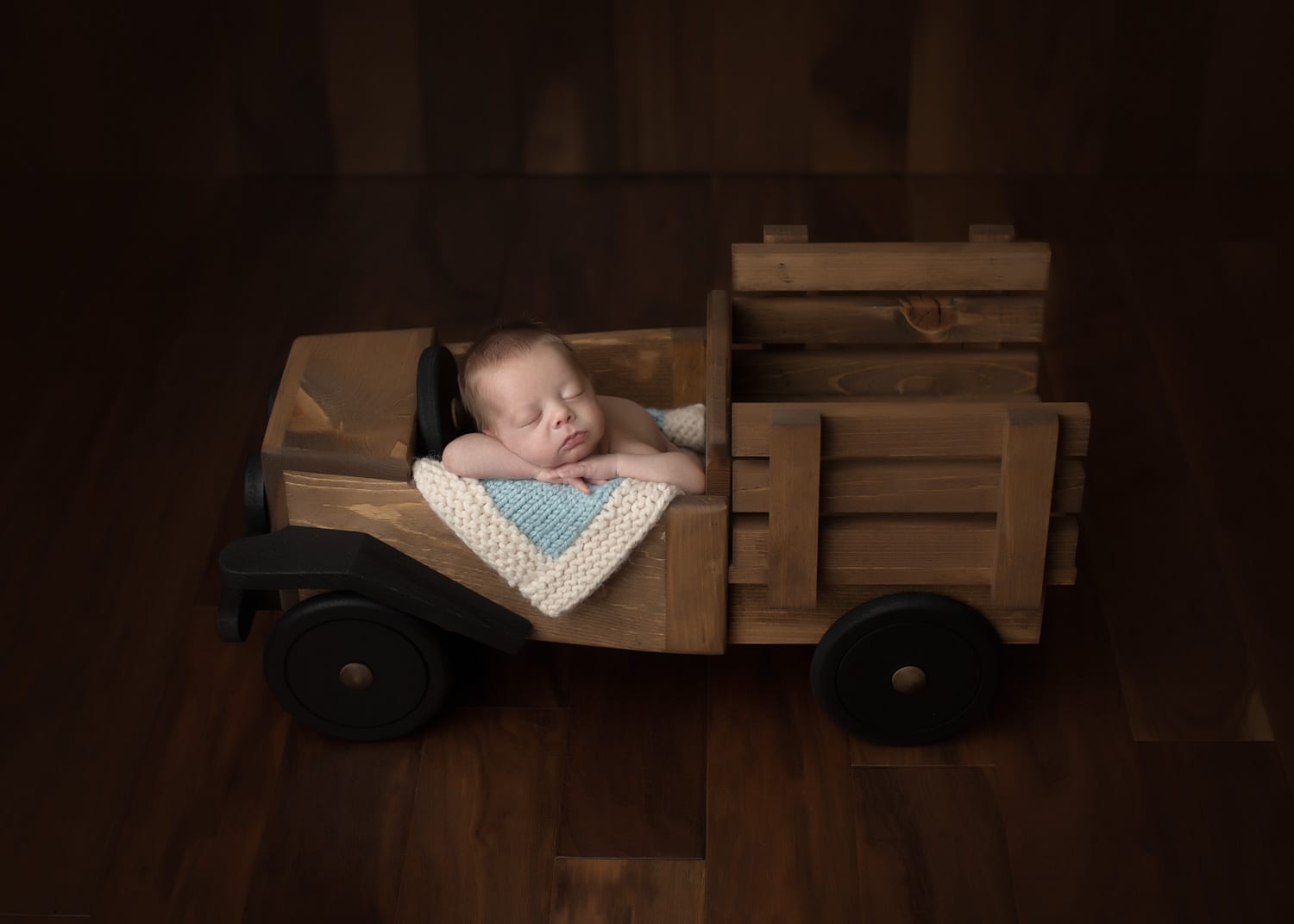 Portland Newborn Photographer baby in truck prop