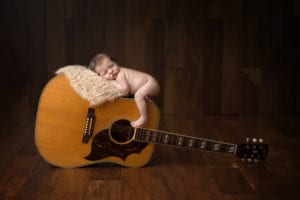 Portland Newborn Photographer Newborn on Guitar