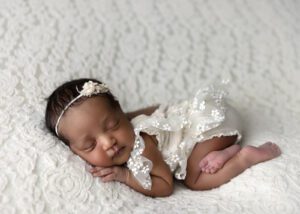 Camas Newborn photographer baby in lace romper
