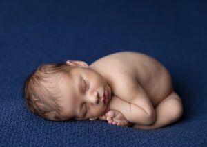 Vancouver WA Newborn Photographer baby on blue backdrop
